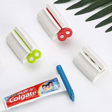 Load image into Gallery viewer, Rolling Toothpaste Tube Dispenser