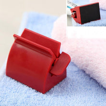 Load image into Gallery viewer, Rolling Toothpaste Tube Dispenser