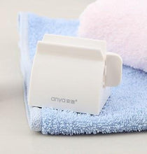Load image into Gallery viewer, Rolling Toothpaste Tube Dispenser