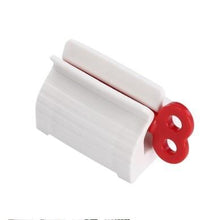 Load image into Gallery viewer, Rolling Toothpaste Tube Dispenser